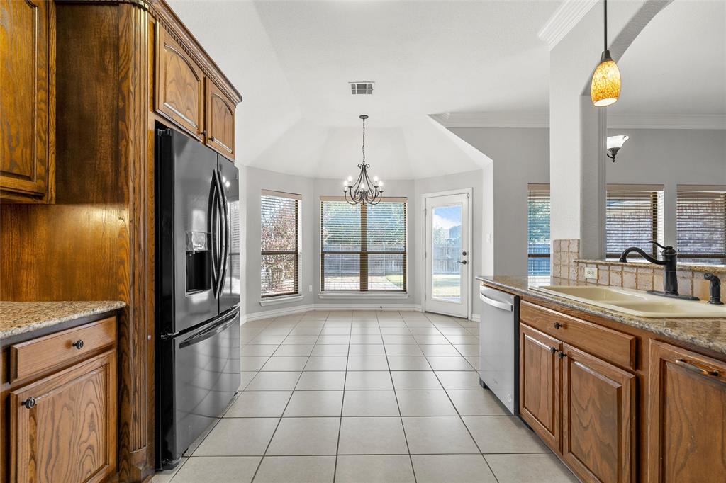 302 Canterbury Road Waco, TX 76712 - Photo 10 of 29 a kitchen with stainless steel appliances granite countertop a refrigerator a sink and dishwasher
