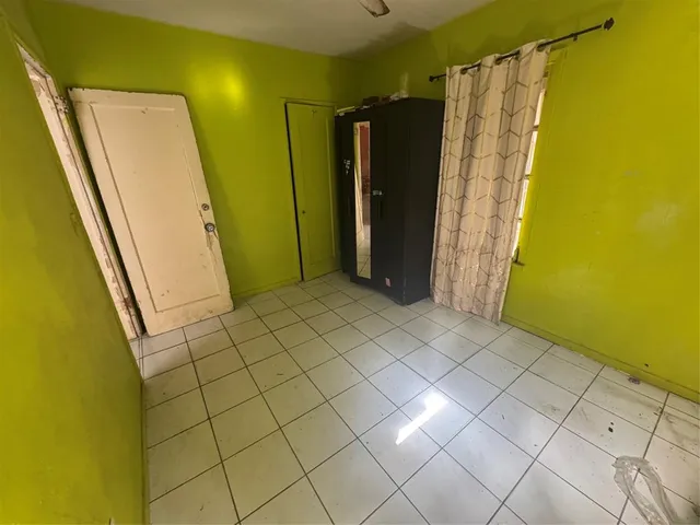 a view of a bathroom with a shower and a tub
