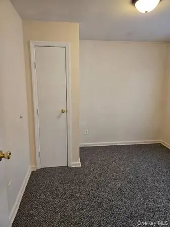 an empty room with a bench