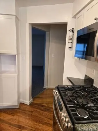 a kitchen with a stove and a microwave