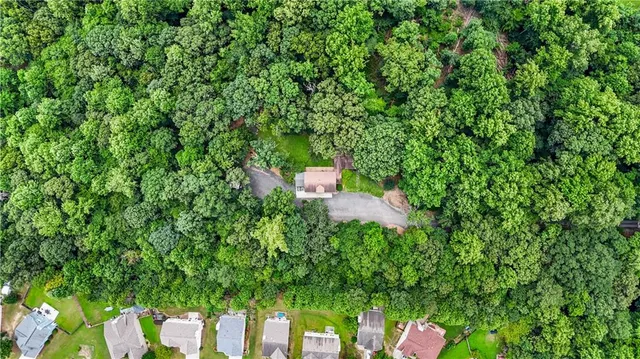 a view of outdoor space with playground and green space