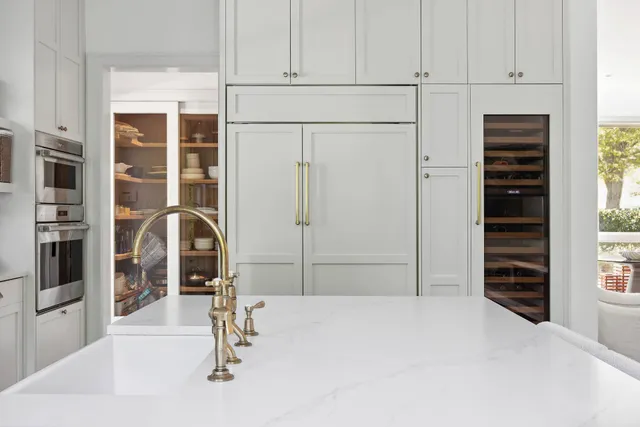 a bedroom with a bed and cabinets