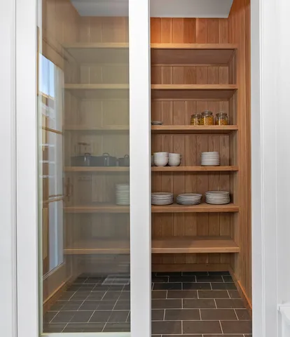 a bathroom with a glass shower door