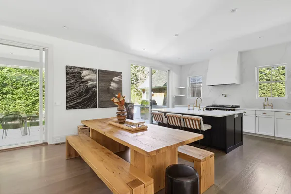 a kitchen with a stove a sink and a refrigerator