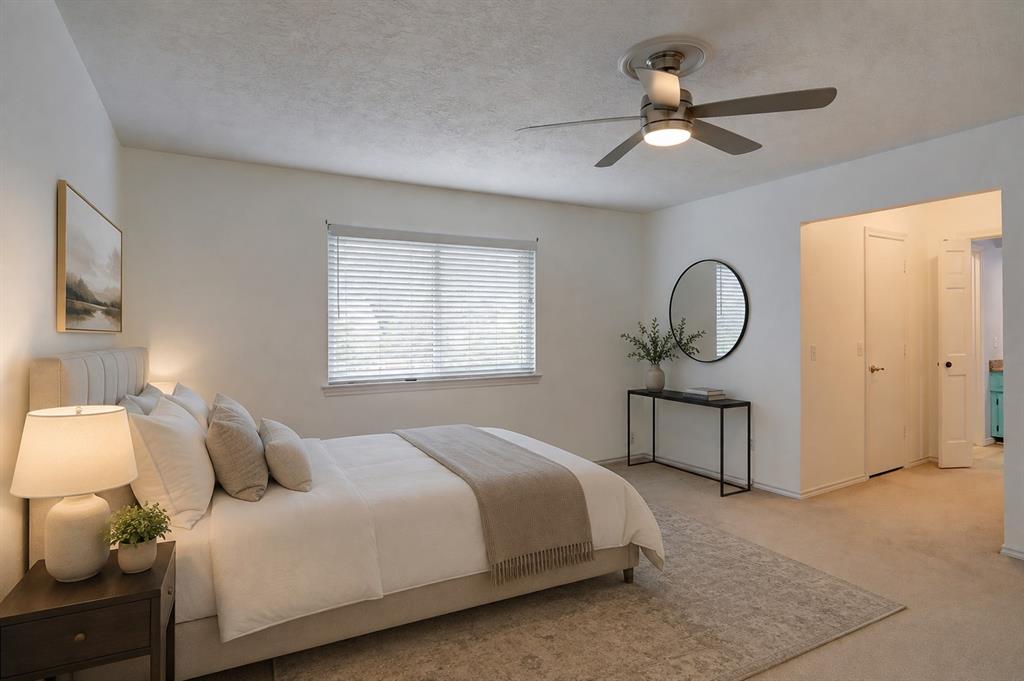 2102 Apollo Road Richardson, TX 75081 - Photo 16 of 28 Ceiling fan with integrated lighting, window with horizontal blinds, neutral wall paint, and carpet flooring