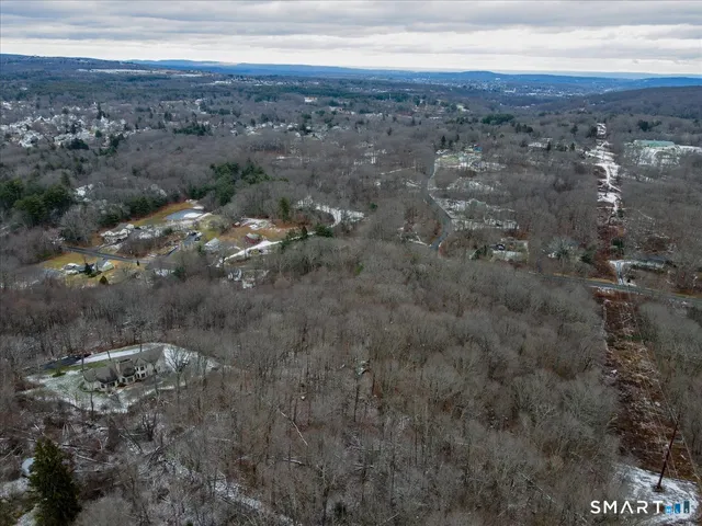 a view of a backyard of the house