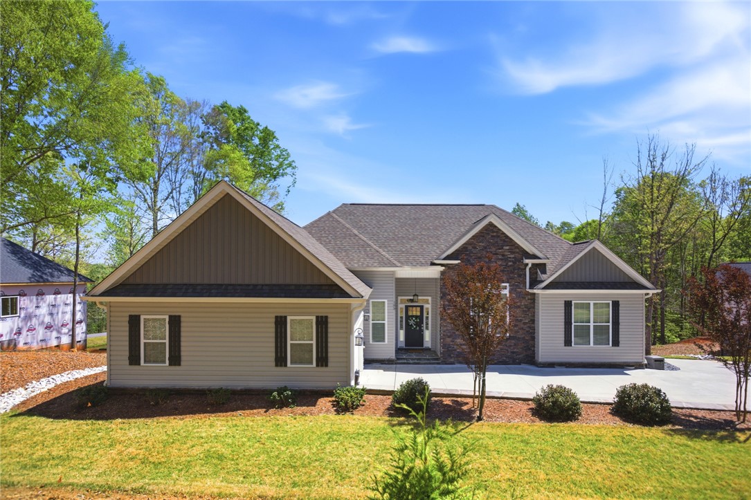 105 Winterbrook Circle Seneca, SC 29678 - Photo 1 of 48 This 3 year old home showcases a charming facade with a blend of natural textures and modern finishes.