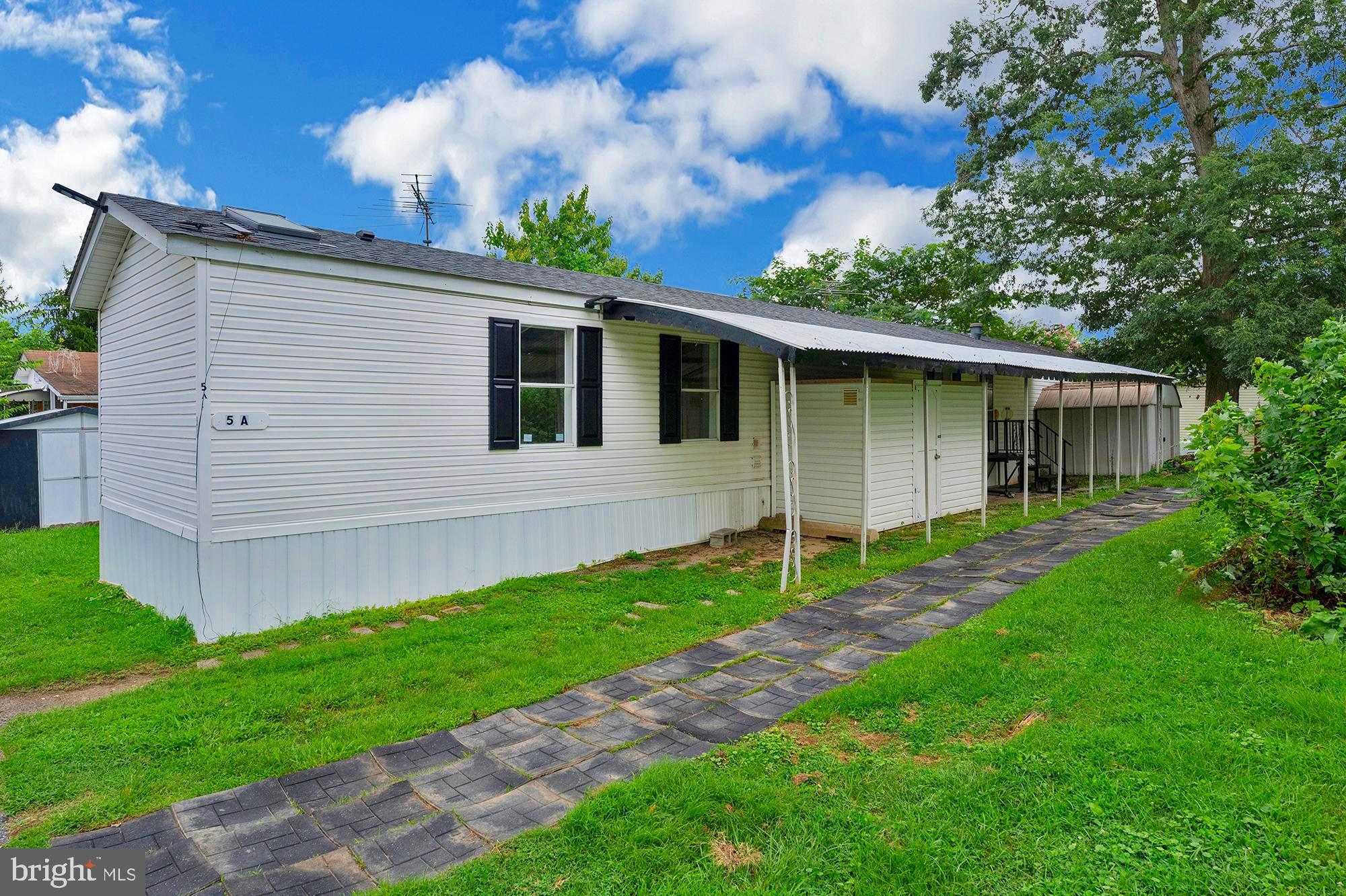 11540 Philadelphia Road, Unit 5A White Marsh, MD 21162 - Photo 21 of 23 a front view of a house with a garden