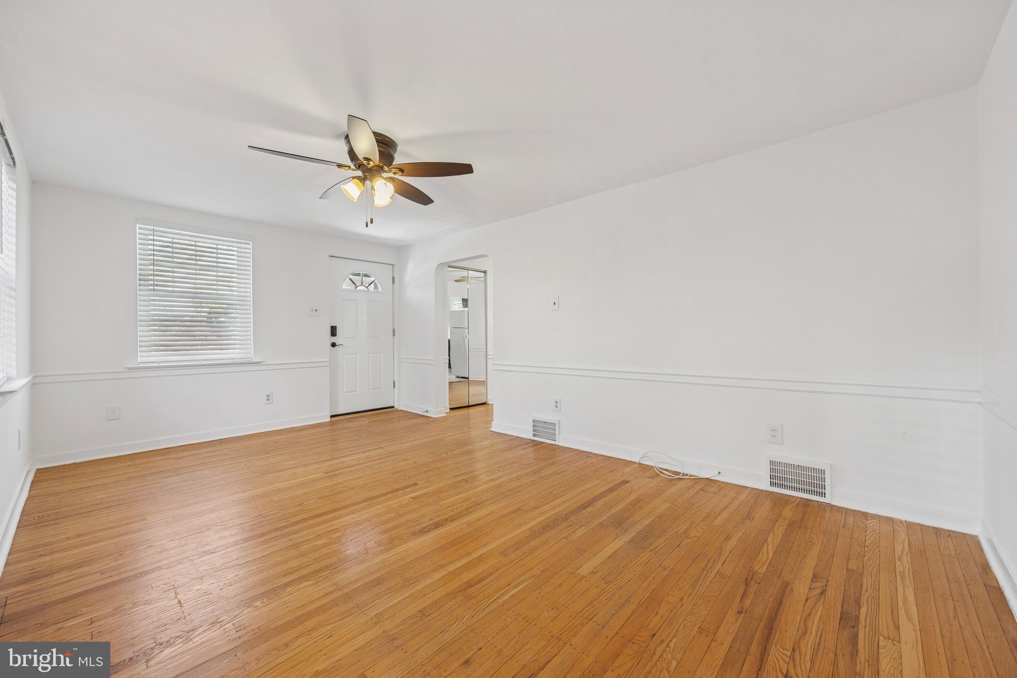 344 Inwood Road Ardmore, PA 19003 - Photo 5 of 16 wooden floor in an empty room with a window