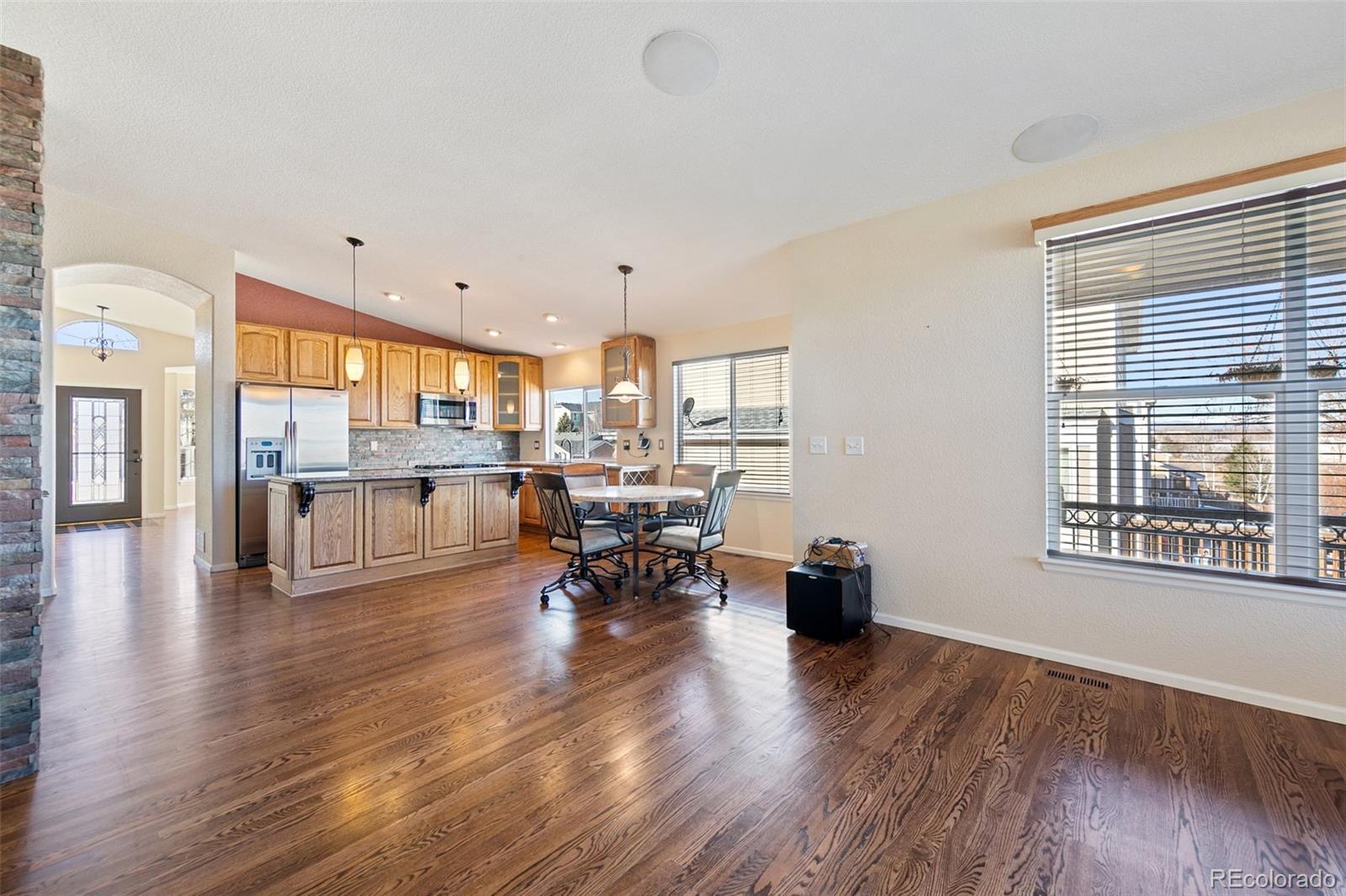 10072 Williams Way Thornton, CO 80229 - Photo 12 of 24 a living room with furniture and a wooden floor