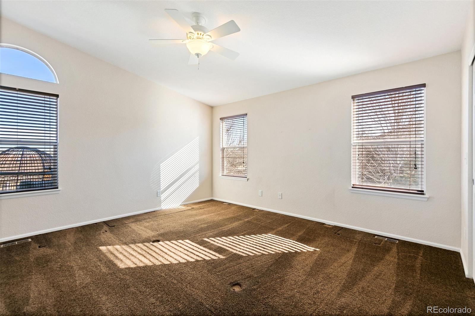 10072 Williams Way Thornton, CO 80229 - Photo 13 of 24 a view of an empty room with a window