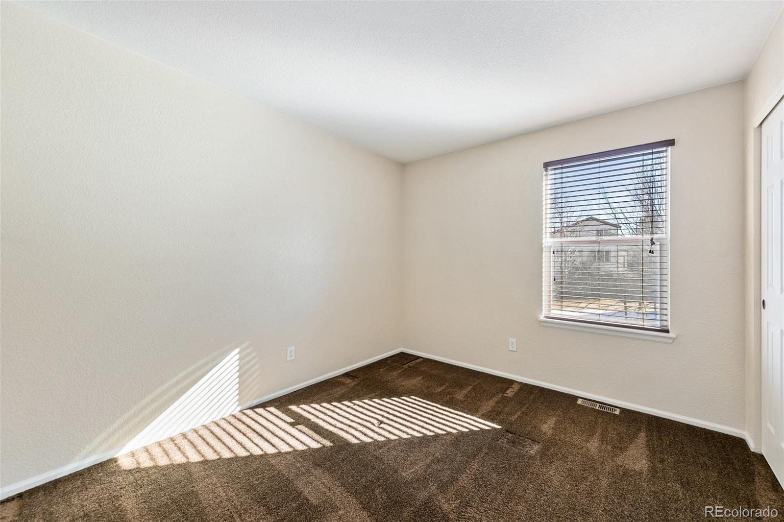 10072 Williams Way Thornton, CO 80229 - Photo 17 of 24 an empty room with a window