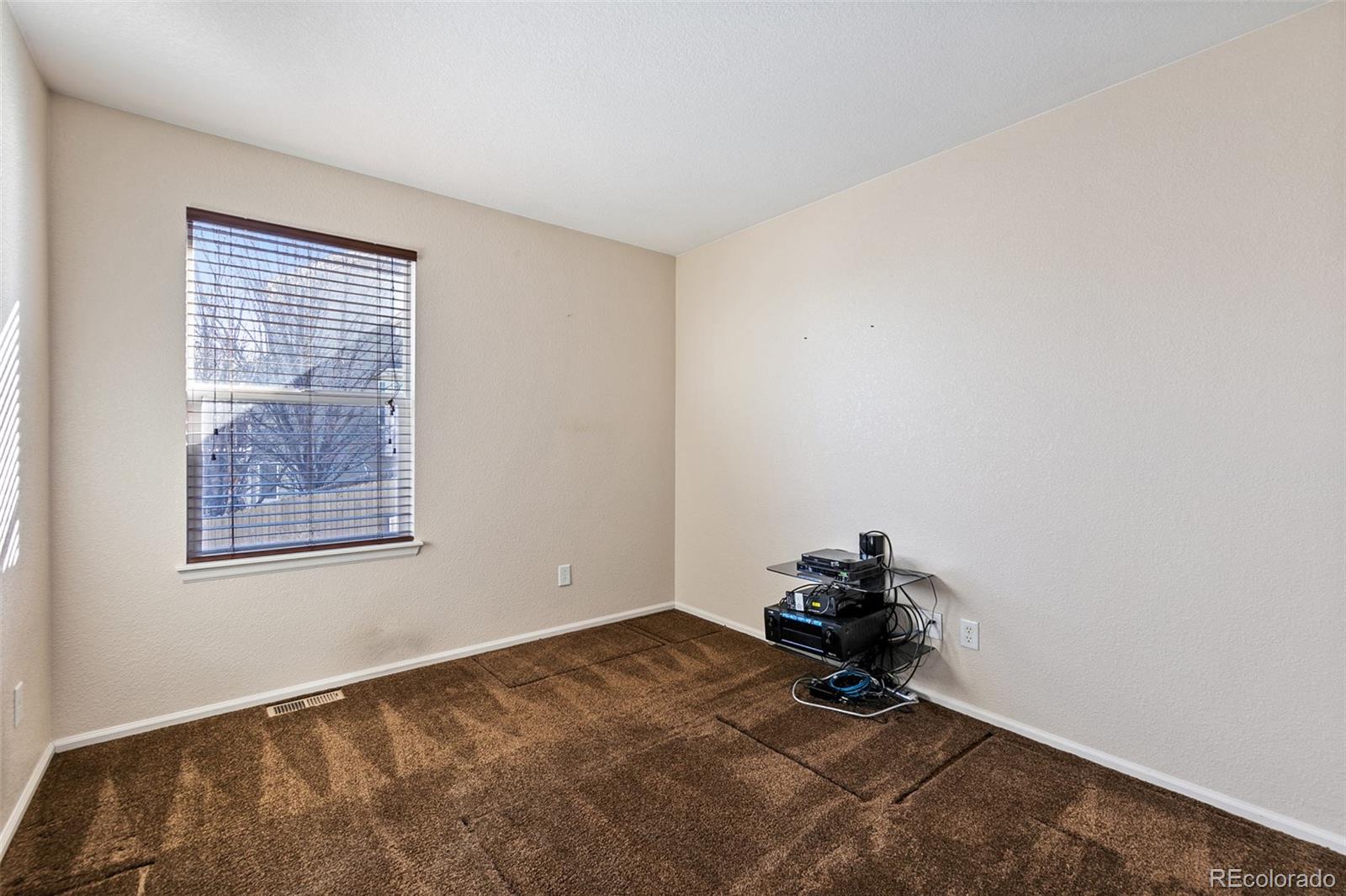 10072 Williams Way Thornton, CO 80229 - Photo 19 of 24 a room with a window