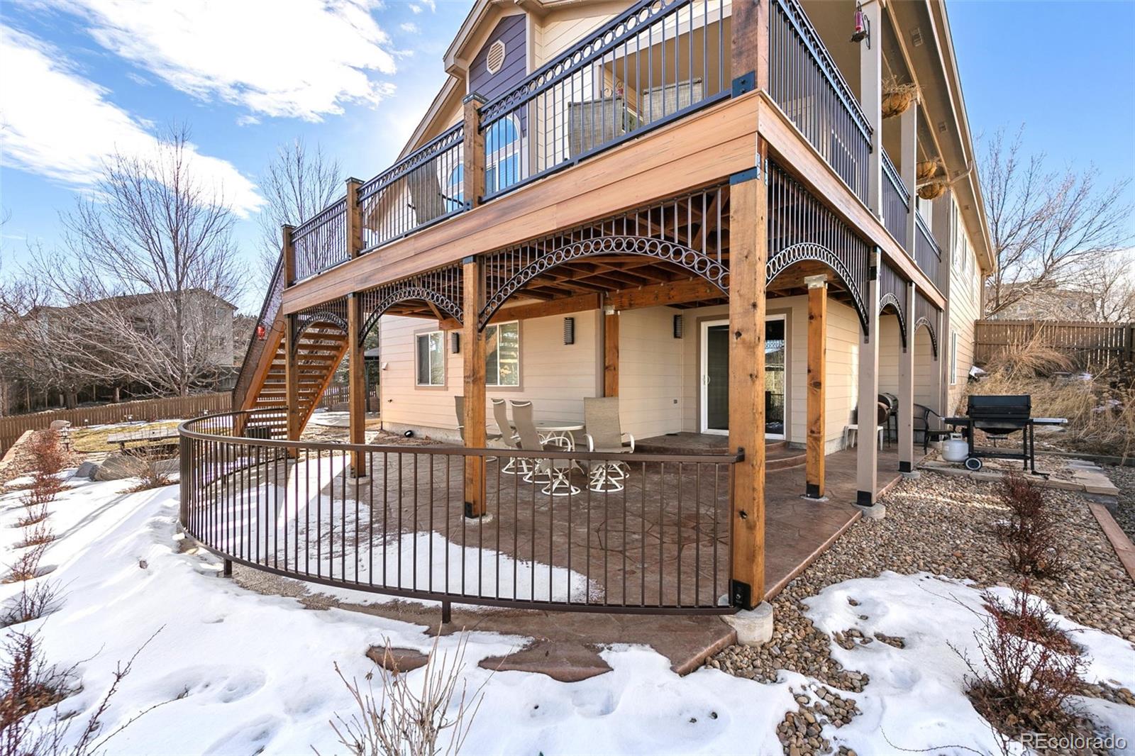 10072 Williams Way Thornton, CO 80229 - Photo 22 of 24 a front view of a house with iron fence