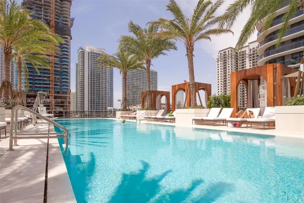a view of a swimming pool with a patio