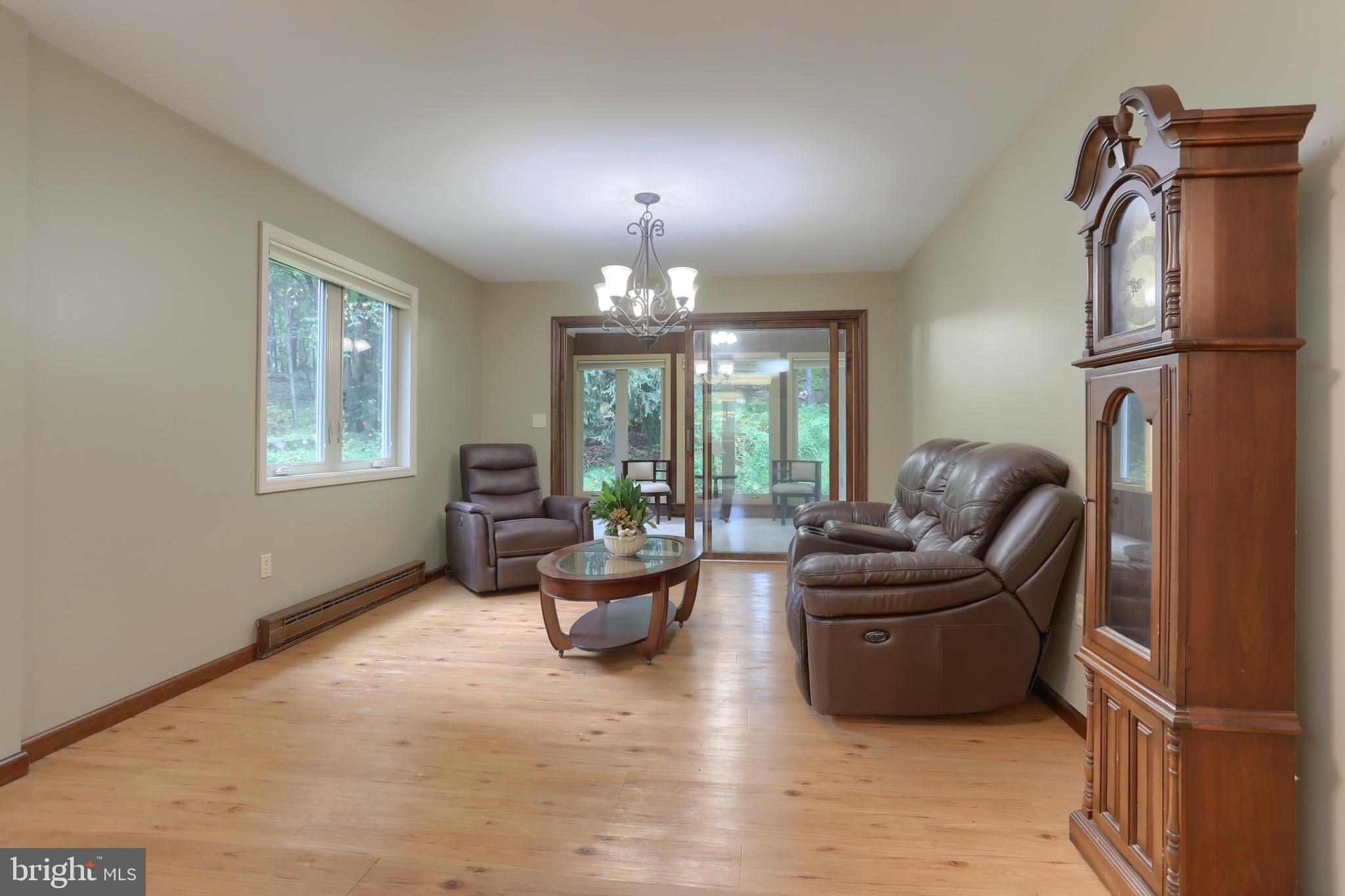 903 Tulip Tree Drive Lebanon, PA 17042 - Photo 14 of 54 a living room with furniture and a chandelier