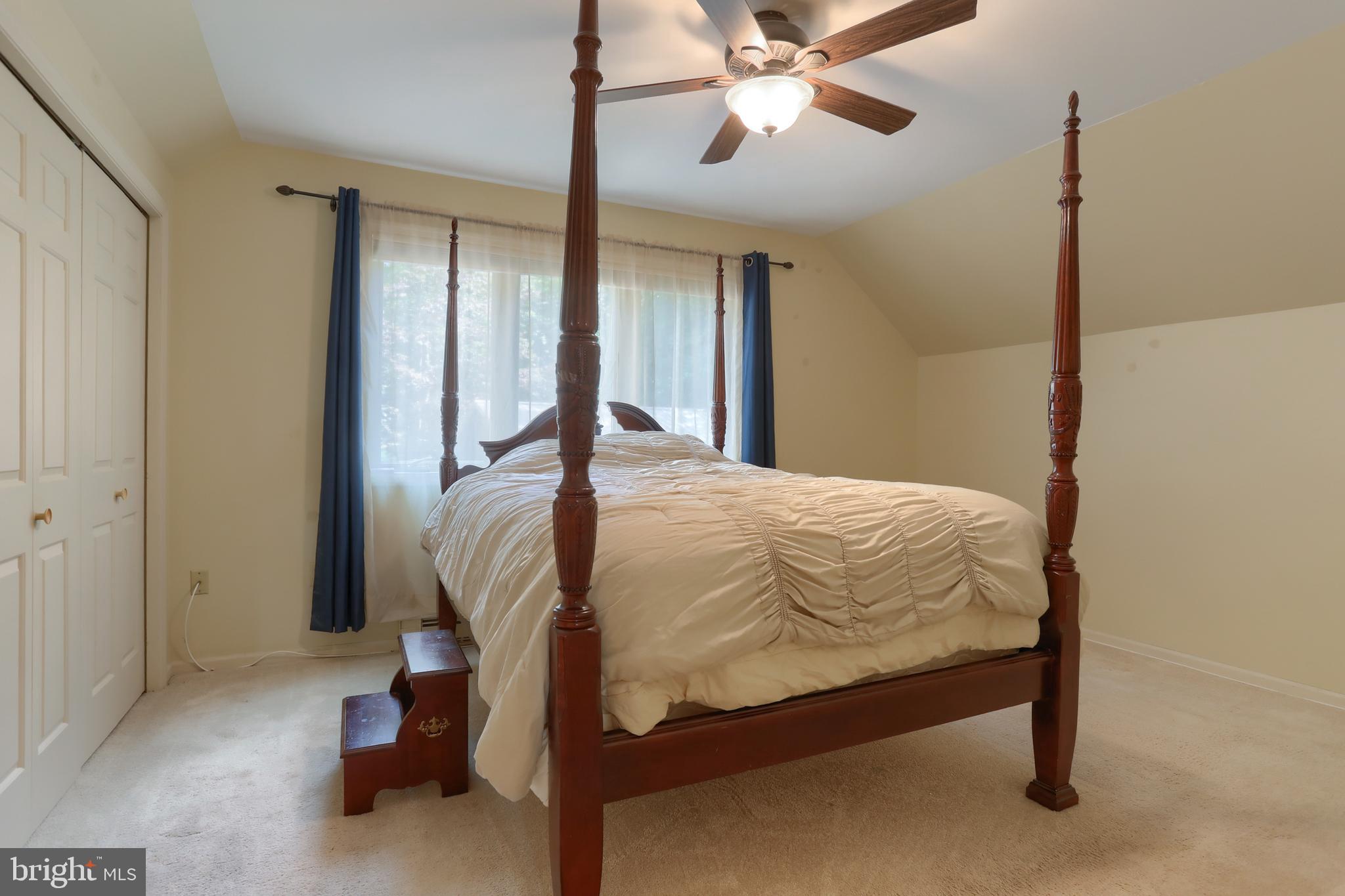903 Tulip Tree Drive Lebanon, PA 17042 - Photo 30 of 54 a bedroom with a bed and a chandelier