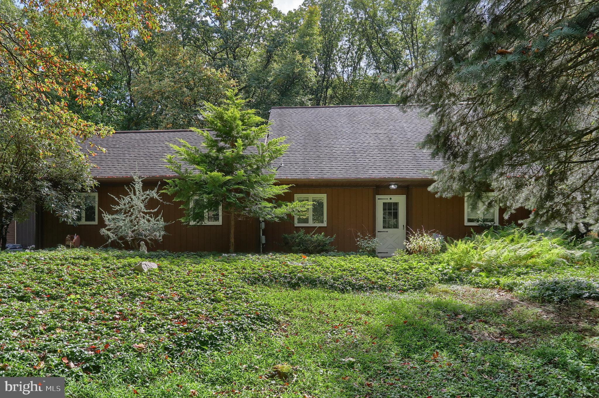 903 Tulip Tree Drive Lebanon, PA 17042 - Photo 6 of 54 a front view of a house with a garden