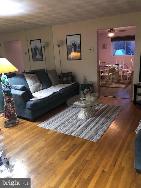 7802 Kavanagh Road Baltimore, MD 21222 - Photo 2 of 9 a living room with furniture and a rug