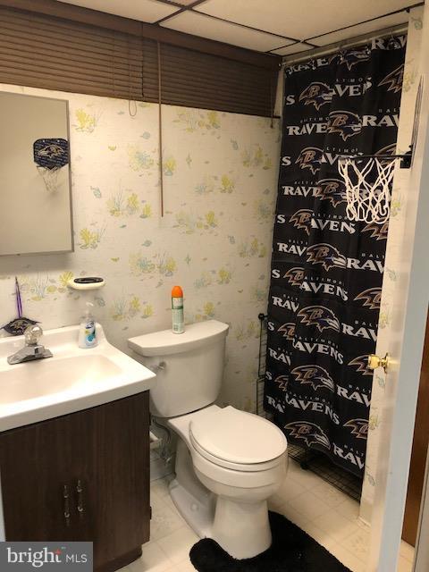7802 Kavanagh Road Baltimore, MD 21222 - Photo 5 of 9 a bathroom with a sink toilet and shower