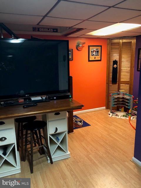 7802 Kavanagh Road Baltimore, MD 21222 - Photo 9 of 9 a room with wooden floor and furniture