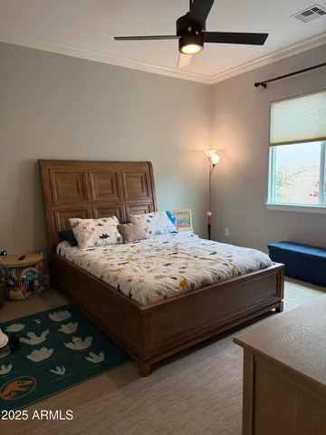 a bedroom with a bed and a dresser