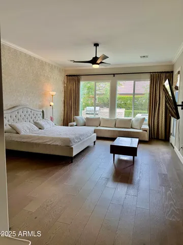 a bedroom with a bed and a couch