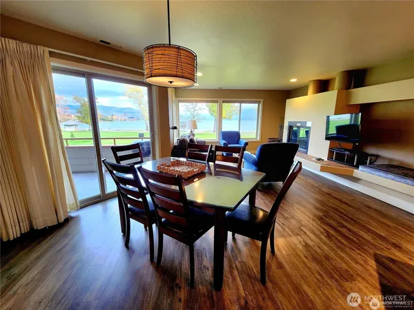 a view of a dining room with furniture window and wooden floor