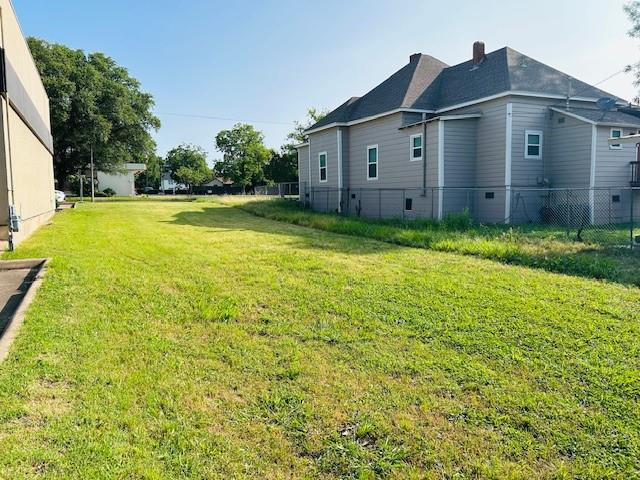 Tbd West Main Street Denison, TX 75020 - Photo 2 of 8 a view of a big house with a big yard and large trees