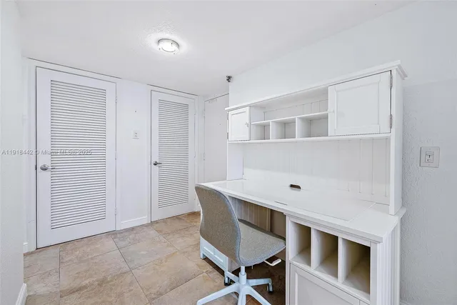 a room with a table and chairs