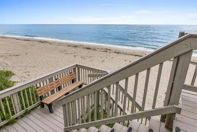 a view of balcony with wooden floor