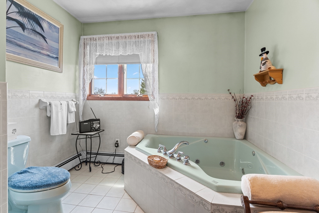 36 High Street Freetown, MA 02702 - Photo 30 of 42 a bathroom with a sink a toilet and a tub