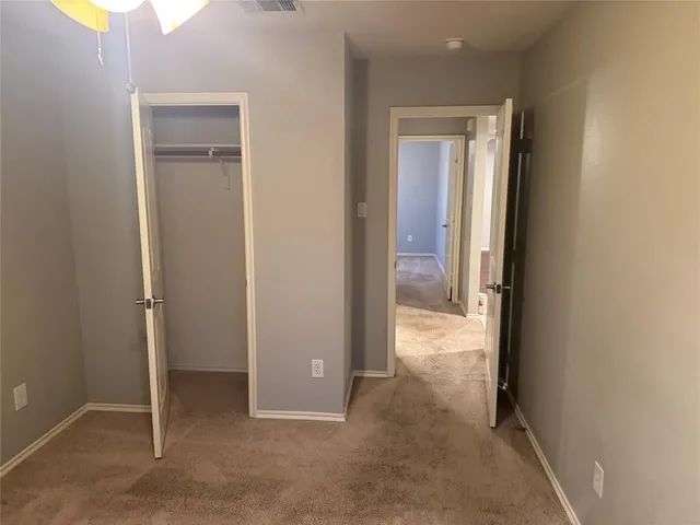 a kitchen with granite countertop a stove and wooden floor