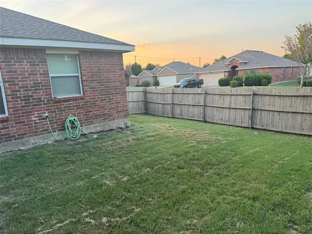 a view of a backyard with a garden and stairs