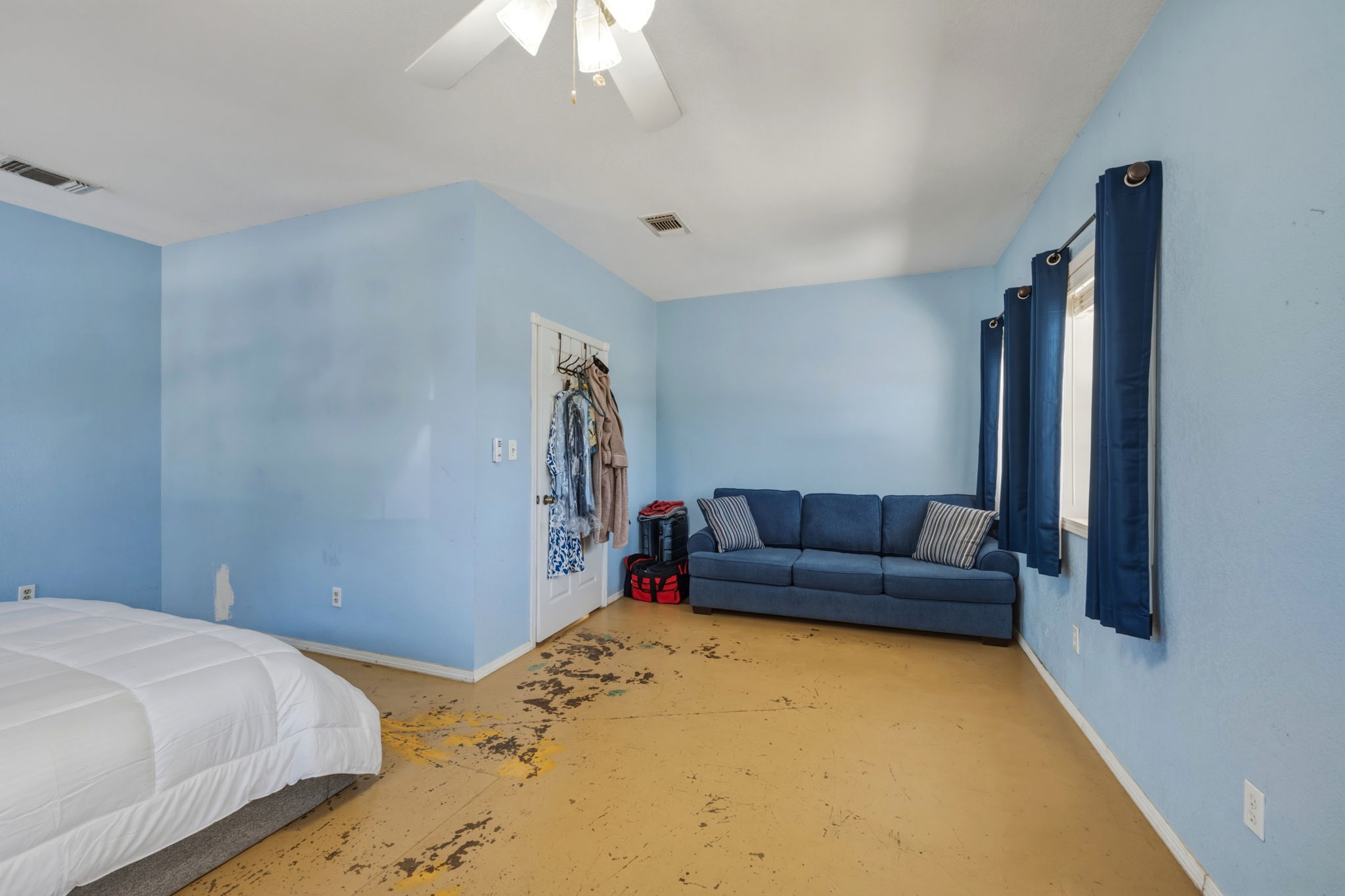 1301 Altwein Road Blanco, TX 78606 - Photo 23 of 40 Bedroom with a ceiling fan and concrete floors