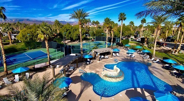 8175 Arville Street, Unit 210 Las Vegas, NV 89139 - Photo 25 of 36 Community pool with a patio and a tennis court