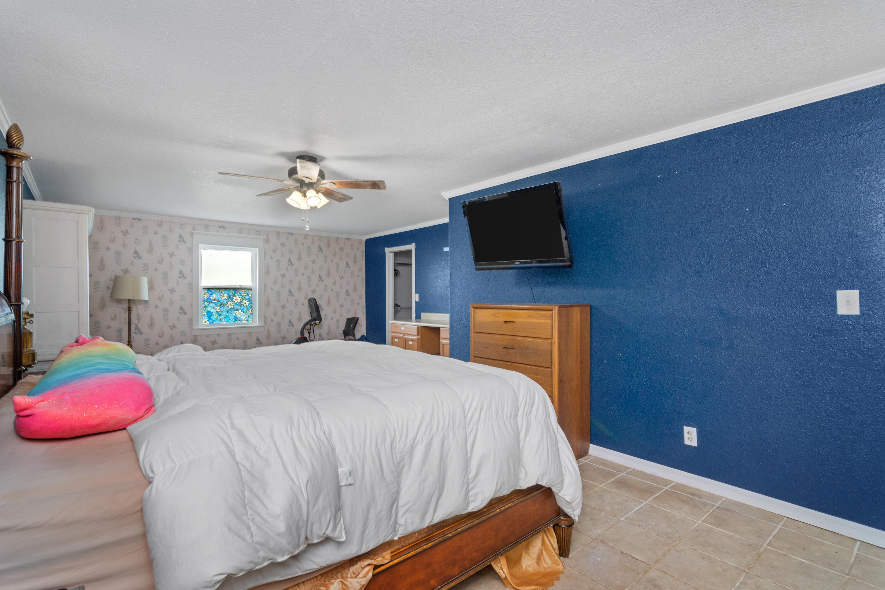 6072 Jack Stokes Road Baker, FL 32531 - Photo 29 of 29 a bedroom with a bed and a flat screen tv