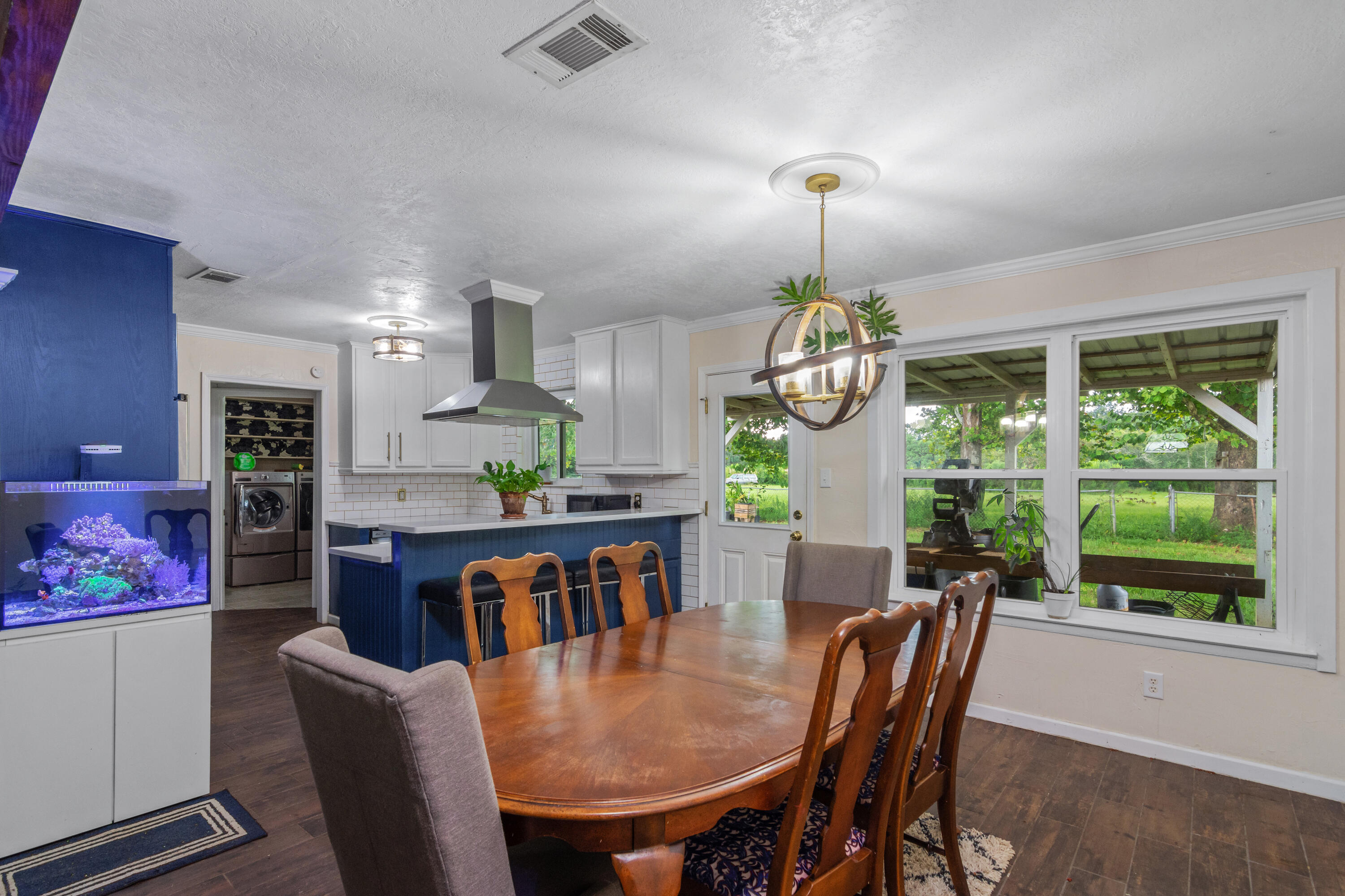 6072 Jack Stokes Road Baker, FL 32531 - Photo 6 of 29 a view of a dining room with furniture window and outside view