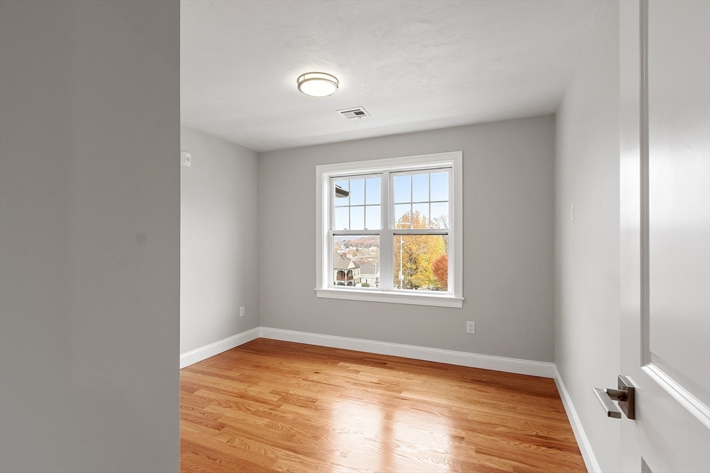 10 Windsor Street Worcester, MA 01605 - Photo 22 of 26 a view of an empty room and window