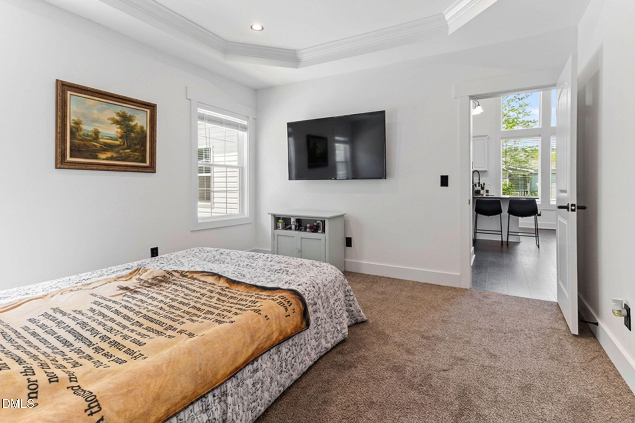 1300 Atlantic Street East Wilson, NC 27893 - Photo 18 of 28 a bedroom with a large bed and a flat screen tv