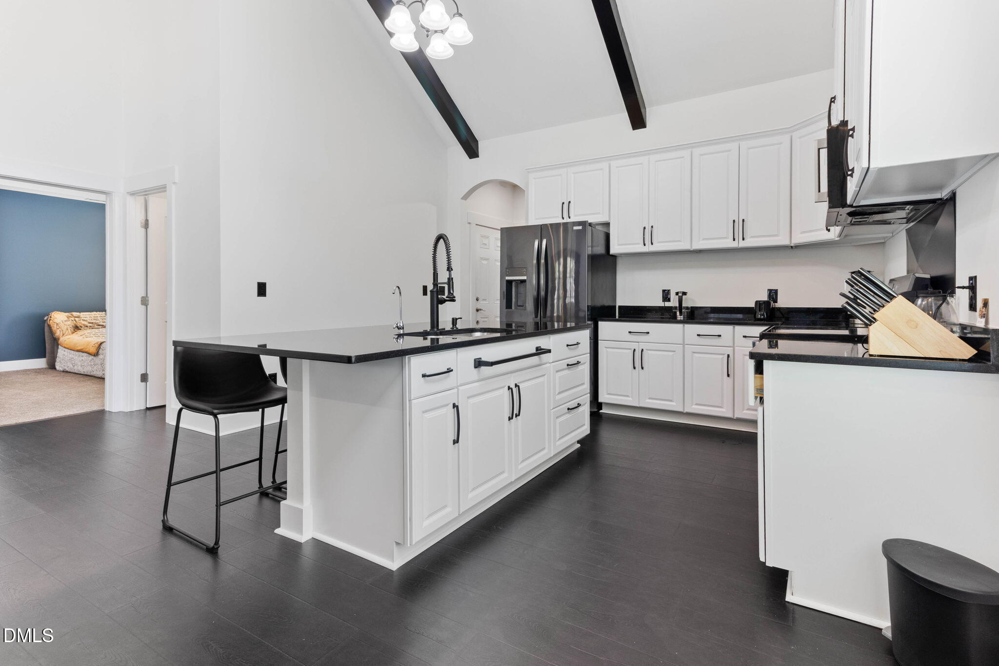 1300 Atlantic Street East Wilson, NC 27893 - Photo 19 of 28 a kitchen with stainless steel appliances kitchen island hardwood floor sink stove and cabinets