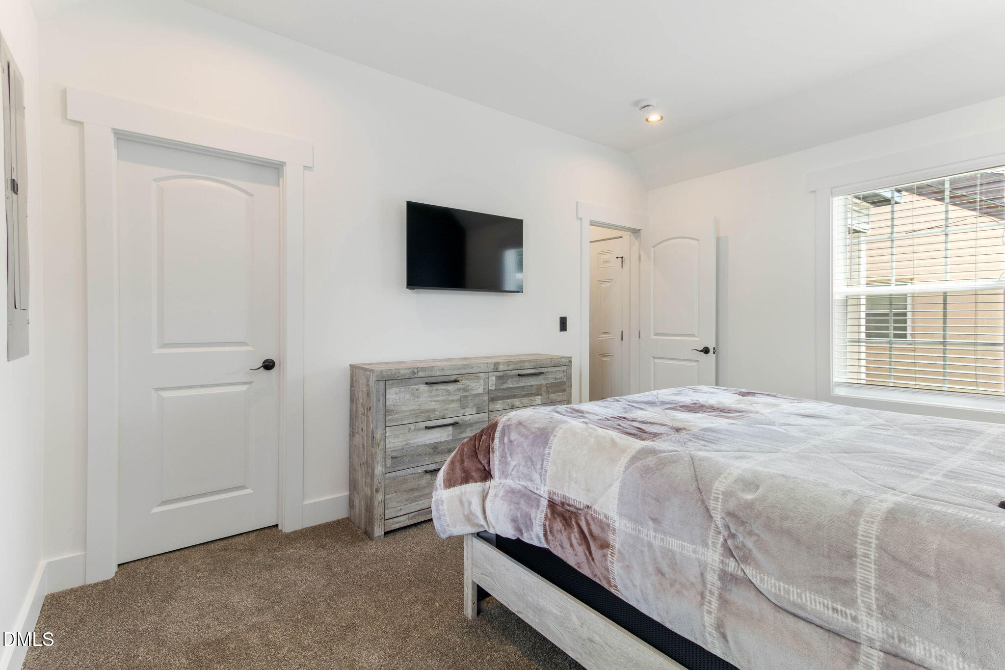 1300 Atlantic Street East Wilson, NC 27893 - Photo 24 of 28 a bedroom with a bed and a flat screen tv