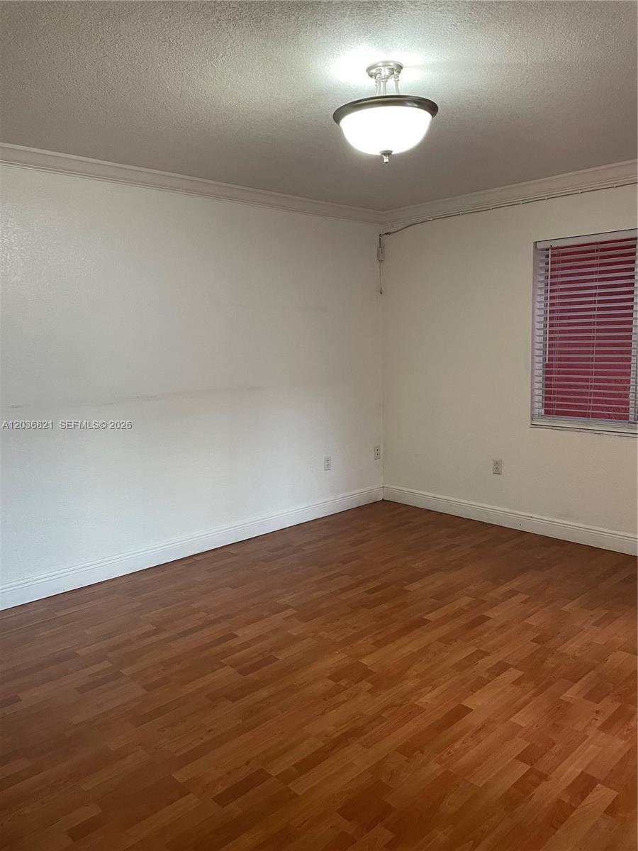 14770 Southwest 60th Street Miami, FL 33193 - Photo 8 of 16 an empty room with a empty space and window