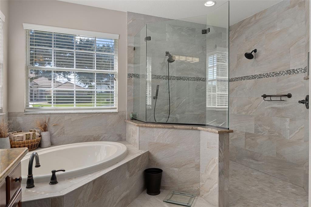 1601 North Tee Time Terrace Hernando, FL 34442 - Photo 47 of 69 a bathroom with a tub a shower and a window