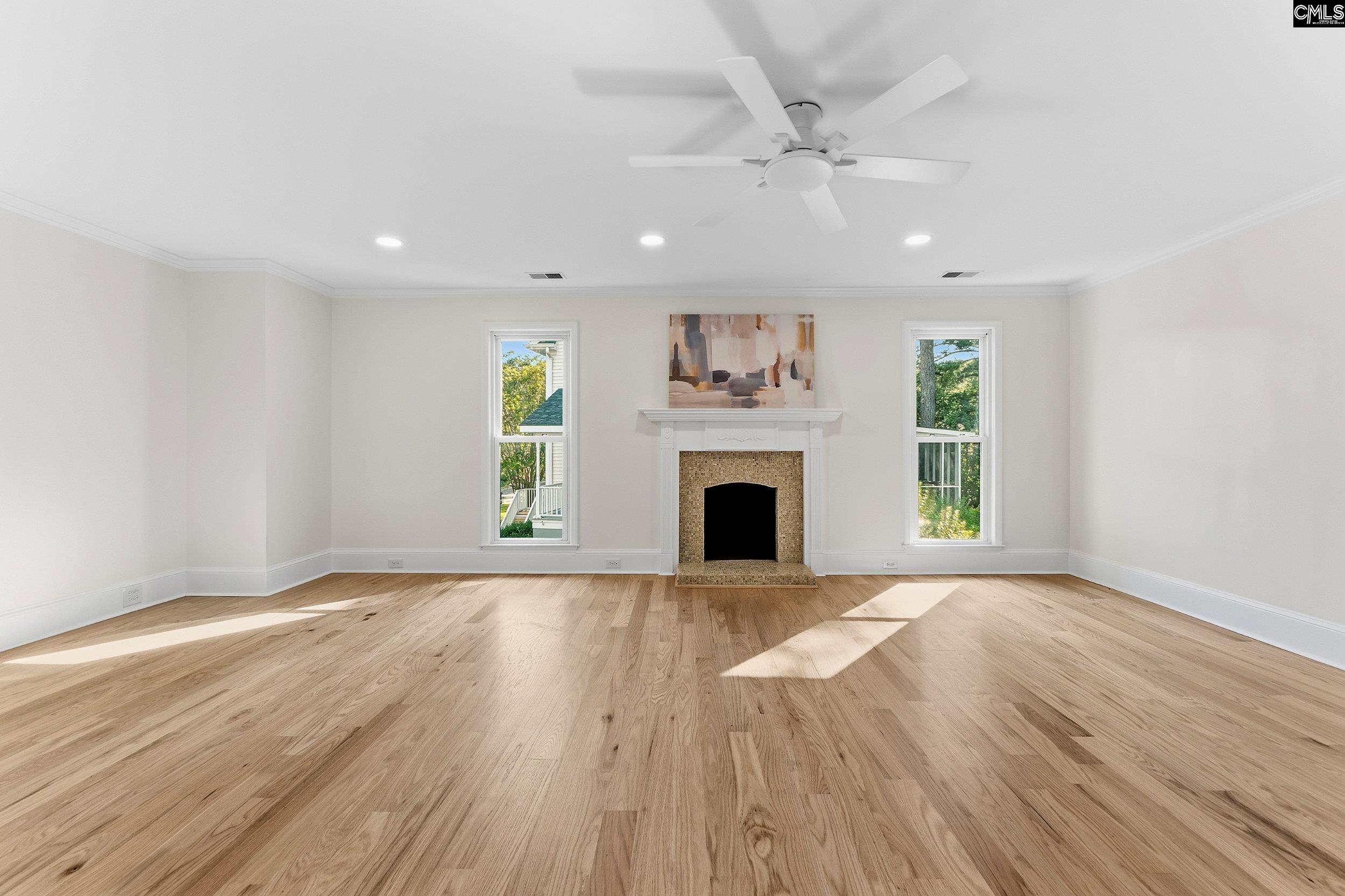 121 Silver Lake Road East Columbia, SC 29223 - Photo 36 of 57 a view of empty room with wooden floor and fireplace