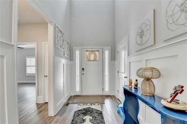 a view of a kitchen with furniture and a chandelier