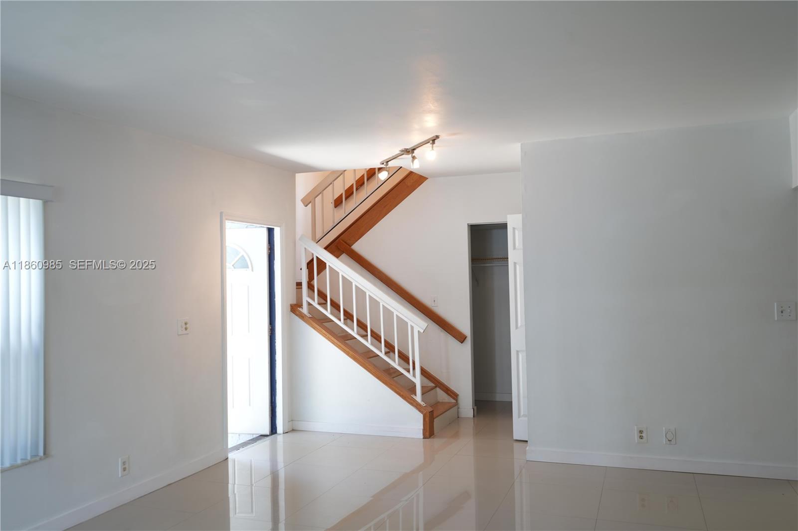 2800 South University Drive, Unit 2A Davie, FL 33328 - Photo 13 of 23 a view of staircase with white walls and a window