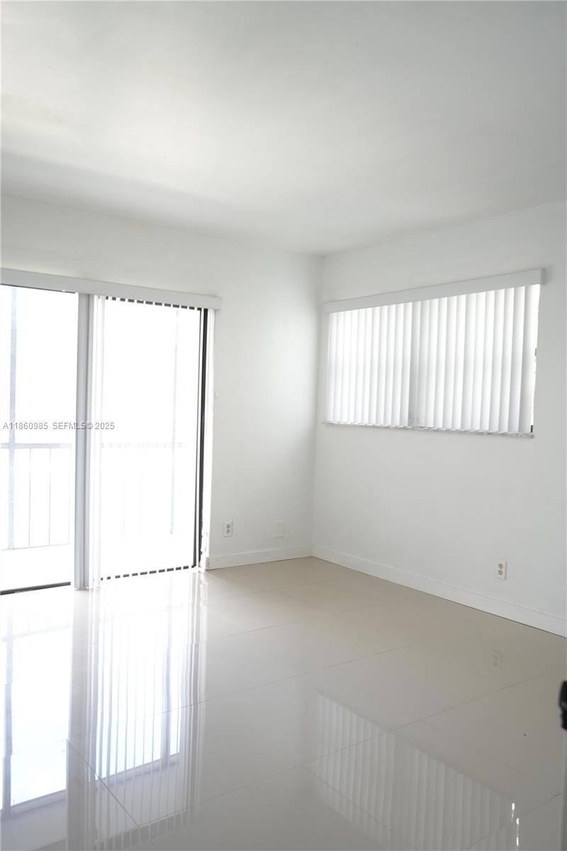 2800 South University Drive, Unit 2A Davie, FL 33328 - Photo 21 of 23 an empty room with windows