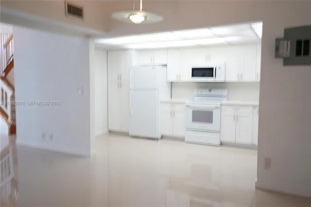 a view of a kitchen with a sink