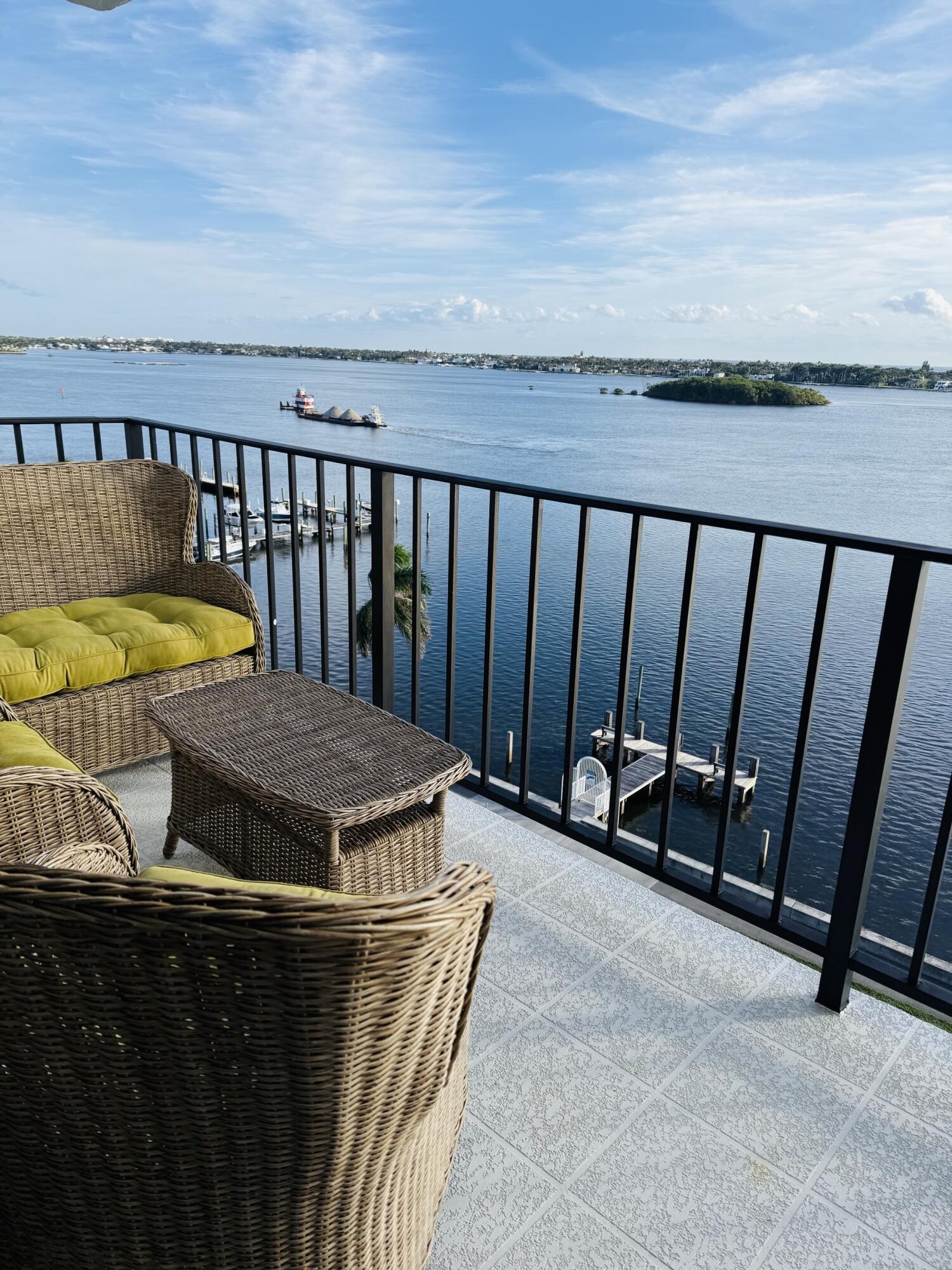 3800 Washington Road, Unit 907 West Palm Beach, FL 33405 - Photo 6 of 8 a view of a balcony with chairs